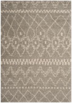 a gray rug with white designs on it