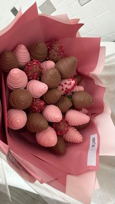 a bouquet of chocolates wrapped in pink paper