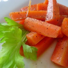 chopped carrots and parsley on a white plate