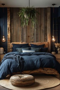 a bed with blue linens and pillows in a room that has wood paneling on the wall