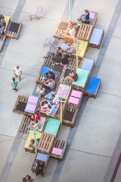 an overhead view of people sitting at tables