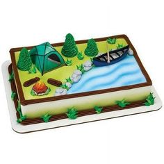 a birthday cake with a camping scene on it