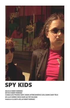 an advertisement for spy kids featuring two girls in front of a store with sunglasses on