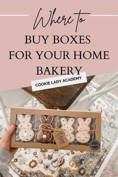 someone holding up a box with cookies in it and the words where to buy boxes for your home bakery