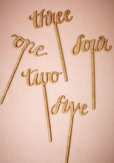 there are three cake toppers that have the words two o'clock on them