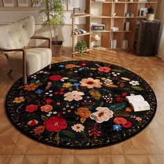 a living room area with a rug and chair in the corner, bookshelf behind it