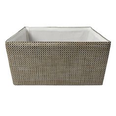 a basket that is made out of wicker and has a white lining on the bottom