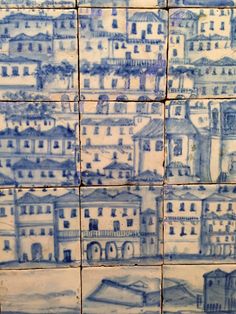 some blue and white tiles with buildings on them