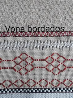 the back side of a rug with red and white stitching on it that says,'yona bordados '