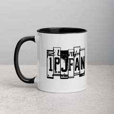 a black and white coffee mug with the word iptan on it's side