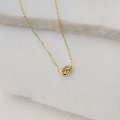 "This sculptural knot necklace captures the joy and whimsy of following your intuition. The knot was made without a plan, just my two hands twisting a piece of wax until it felt good and done. Sprinkle some diamonds on it for an extra dose of sparkles. DETAILS ► Knot measures 5mm x 8mm ► 14k yellow gold ► 16\" or 18\" chain ► Optional conflict-free diamonds measure 1mm each, 4 total, GH-SI LOVE A GOOD SURPRISE? then sign up for early access, first dibs and exclusive offers at www.everlijewelry.c Gold Necklace With Adjustable Sliding Knot, Gold Hand Knotted Necklace For Gift, Diamond Knot Necklace, Luxury One-of-a-kind Pendant Necklace, Knotted Gemstone Necklace, Diamond Knot, Knot Necklace, Personalized Rings, Hand Engraving