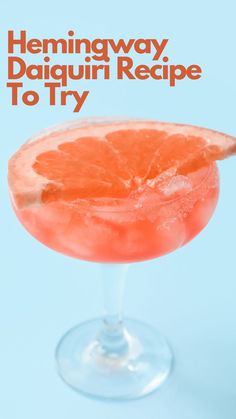 an orange drink in a glass with the words hemingway daiquiri recipe to try