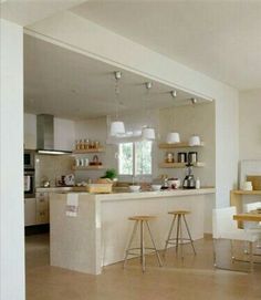 the kitchen is clean and ready to be used for cooking or dining room furniture, as well as several stools