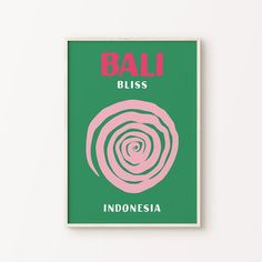 a green and pink poster with the words bali bliss in red, on top of a white wall