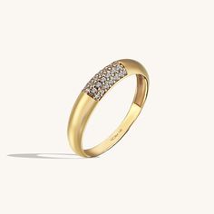 The Minimalist Pave Dome Ring has an elegant design that its plainness with sparkling stones is the modesty which will fascinate people around you. It is perfect for everyday use and ring stacking. - Made in 14k Solid Gold - Decorated with handset white cubic zirconia stone on 14k solid gold - Band Width: 2.50 mm / 0.0 Round Cubic Zirconia Everyday Luxury Ring, Modern Pave Setting Diamond Ring, Luxury Dome Ring With Diamond Accents For Promise, Minimalist Cubic Zirconia Diamond Ring With Pave Setting, Elegant Diamond Dome Promise Ring, Elegant Dome Ring With Prong Setting For Promise, Elegant Diamond Dome Ring With Brilliant Cut, Elegant Diamond White Dome Ring With Prong Setting, Elegant Prong Setting Dome Promise Ring