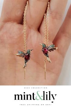 The hummingbird is a symbol of love and happiness. These drop earrings are the perfect way to let the world know that you're filled with joy, and they're also just really pretty! Inspired by the beauty of nature and crafted from 18k gold plated metal with AAA+ CZ stones, these trendy pull-through earrings will make you feel like you're flying through the air on your way to find love. Pave Ear Cuff, Dainty Studs, Pull Through, Love Symbols, Cz Stone, Make You Feel, Beautiful Earrings, Red And Blue, Ear Cuff