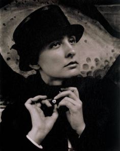 black and white photograph of a woman wearing a hat