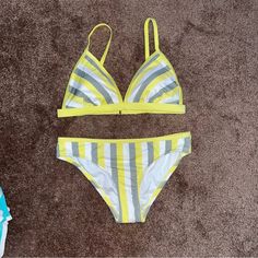 Keep Your Sunny-Day Ensemble Sleek And Stylish With These Medium Coverage Hipster Bikini Set From Kona Solt In A Striped Pattern In Yellow, White And Green Hues For Timeless Appeal You'll Love. It Comes With Adjustable Straps That You Can Keep Straight Or Style Across To Change The Look. The Hipster Bikini Bottoms Are Crafted From A Soft, Stretchy Tabric With Elastic At The Leg Openings To Keep You Nice And Comfortable Throughout Your Sunny Adventures, While The Full Lining Offers Added Coverage You Can Always Count On. A Medium-Coverage Design, Hipster Cut And Allover Stripe Pattern Come Together Perfectly To Create A Swim Bottom That Keeps You Covered While Still Having A Flirty Touch. Tr Casual Yellow Triangle Top Swimwear, Yellow Triangle Top Swimwear With Stretch, Stretch Yellow Triangle Top Intimate, Swim Bottoms, Yellow White, Stripes Pattern, Womens Swim, Swimming, Things To Come