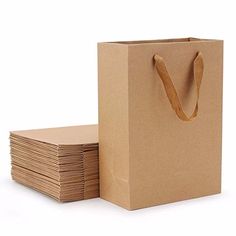 a brown paper bag next to stacks of papers