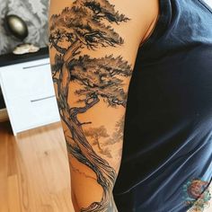 a woman with a tree tattoo on her arm