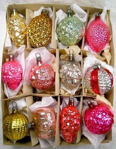 a box filled with assorted christmas ornaments