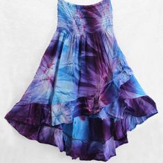 Fantastic Tie-Dye Ruffled Hi-Lo Skirt Can Also Be Worn As A Top! Brand New From Importer, Available In Small, Medium And Large. Beautiful Blues & Purples, Fun & Flirty And Extremely Comfortable. Light Weight, Soft And Flowy, 100% Rayon Fabric. Elastic Top Stretches To Fit Without Binding Or Rolling. Skirt Is About 21 Inches In Front To 33 Inches In Back. Gentle Wash, Drip Dry Recommended. Purple Flowy Skirt For Summer, Flowy Purple Skirt For Summer, Purple Cotton Beach Skirt, Bohemian Tie Dye Tiered Skirt, Bohemian Tiered Tie Dye Skirt, Casual Purple Maxi Skirt For Beach, Blue Bohemian Ruffled Dress, Blue Bohemian Dress With Ruffled Skirt, Purple Long Skirt For Summer