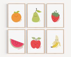 four framed pictures with fruits and vegetables on them, one is for the child's room