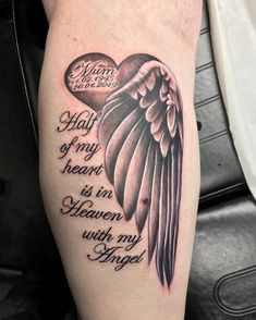 a tattoo on the leg of a woman with an angel wing and words that read, hail my heart is in heaven with my wings