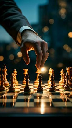 a man is playing chess with his hand on the board