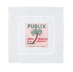 a white towel with a palm tree on it and the words publix in red