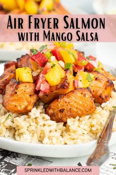 air fryer salmon with mango salsa on top of rice