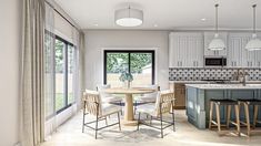 a kitchen and dining area with white cabinets, counter tops, and bar stools