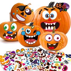 four pumpkins with faces and stickers on them