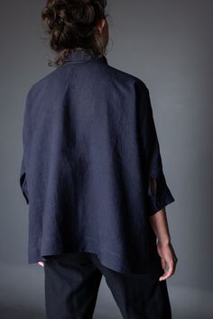 the back view of a woman wearing a dark blue shirt