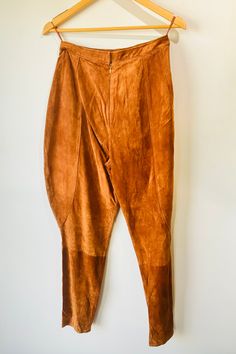 Vintage Anne Klein Cognac Suede Jodhpurs. Giddy up! A beautiful pair of 100% suede pants in a cognac brown. Pant legs flair out in the thigh for an equestrian style. Zipper closure going up the middle back. Size 10. In excellent vintage condition. Dry clean. Approx. Measurements: Length: 42" Inseam: 26" Waist: 28" Elegant Brown Leather Pants Full Length, Elegant Brown Full-length Leather Pants, Elegant Full-length Brown Leather Pants, Elegant Full Length Brown Leather Pants, Brown Suede Pants For Fall, Fall Brown Suede Pants, Jodhpur Pants, Suede Pants, Jodhpur