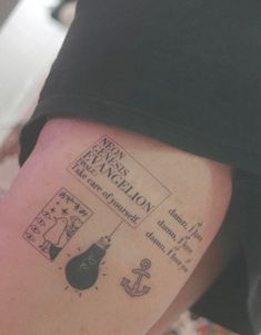 a person with a tattoo on their leg that has words and pictures written on it