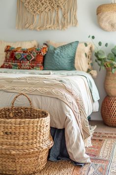 a bedroom with wicker baskets on the floor and wall hangings above the bed