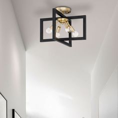 a bathroom with white walls and black fixtures