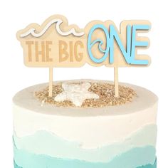 there is a cake that has been decorated with the word'the big one '