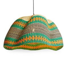 a green and orange hat hanging from a hook