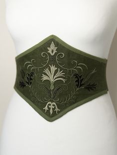 "The Spicy Garden" Do you like corsets but also like feeling comfortable in your clothes? This belt is made for you! This is an embroidered elastic waist cincher, made of quality linen. Steel bones on the front of the belt provide support and give the illusion that it is a real corset. The sturdy elastic that makes up the back of this accessory provides greater sheathing than a classic belt and will adapt perfectly to your size. The embroidered pattern was created in our workshop for this unique collection (machine embroidery). It is available in several colors. Handmade item in France (and with great care Linen Corset, Cincher Belt, Classic Belt, Corset Belt, Fashion Illustration Dresses, Corset Lingerie, Embroidered Linen, Couture Sewing, Waist Cincher