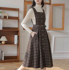 Our Sorrell Dark Academia Plaid Wool Pinafore Dress is perfect for stepping back into the golden age of learning and literature. Crafted with a sumptuous wool blend, this elegant pinafore dress is designed with a timeless plaid pattern and a chic, adjustable belt, creating a distinctive academia look perfect for enchanting dark academia evenings. (Top not included) Skirt Pockets Pattern, Sarafan Dress Fashion, Wilbur Outfits, Wool Pinafore, Dark Cottagecore Fashion, Pinafore Dress Outfit, Pinafore Outfit, Fairycore Princess, Pinafore Dress Pattern