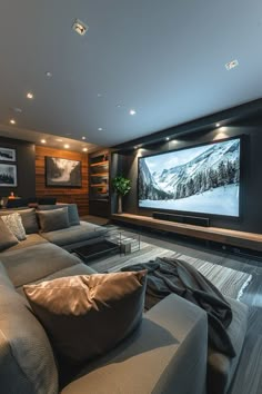 a living room filled with furniture and a flat screen tv mounted to the side of a wall