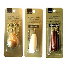 three packaged items in plastic packaging with beading on the ends and beads hanging from them