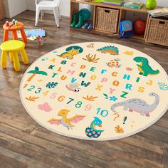 a child's playroom with toys and rugs on the floor, including an animal theme