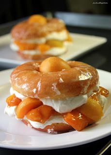 two desserts on white plates sitting on a table