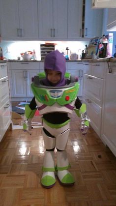 a young boy dressed as buzz lightyear from toy story