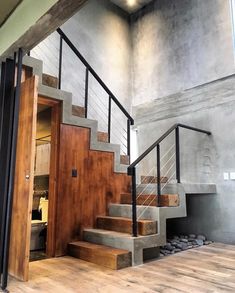 the stairs are made of concrete and wood