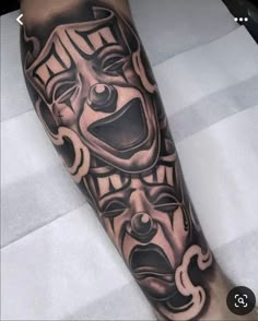 a man's leg with a black and grey tattoo design on the arm,