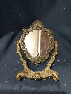 a mirror sitting on top of a blue cloth